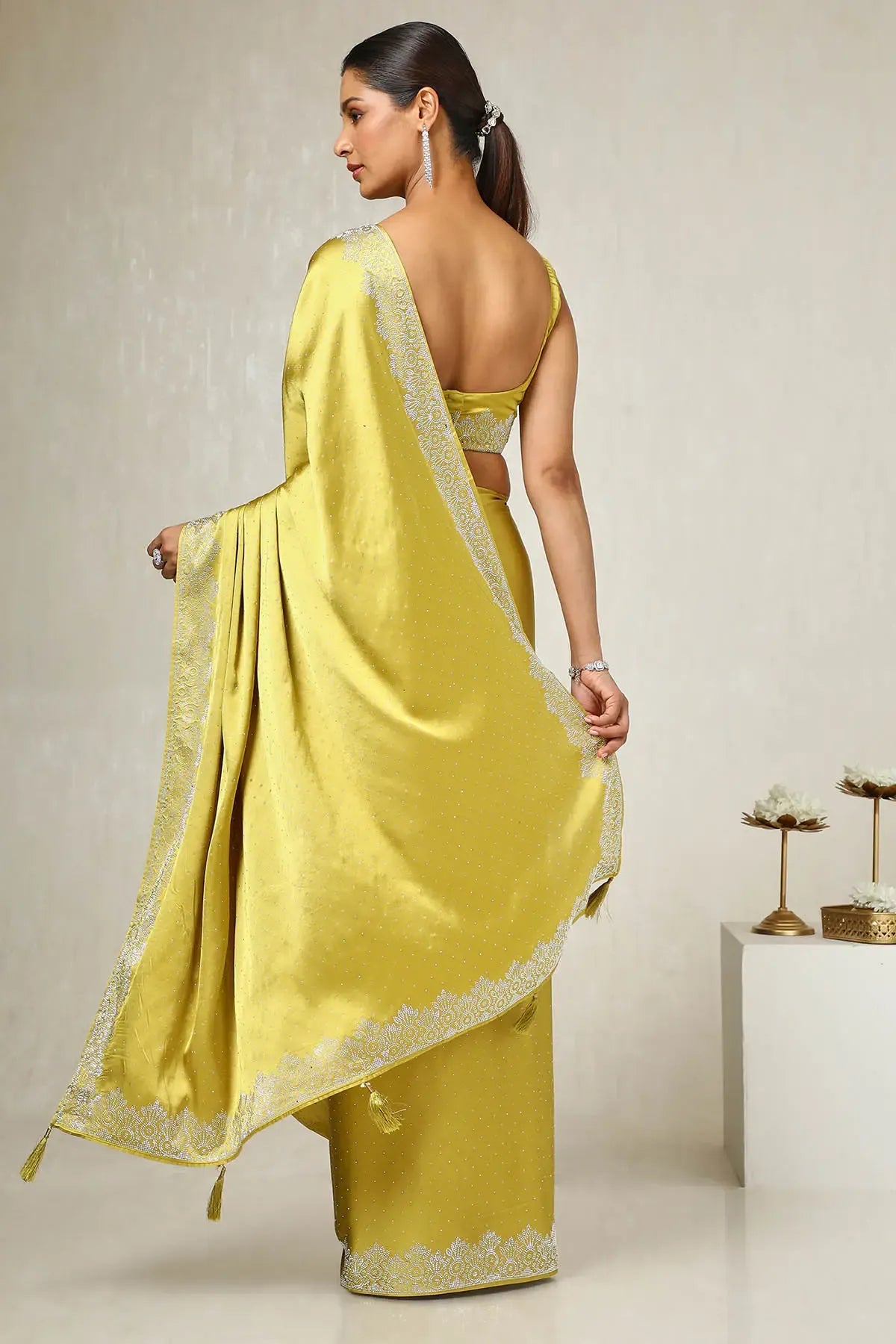 Mustard ready to wear satin party saree by Fulari with subtle stone embellishments