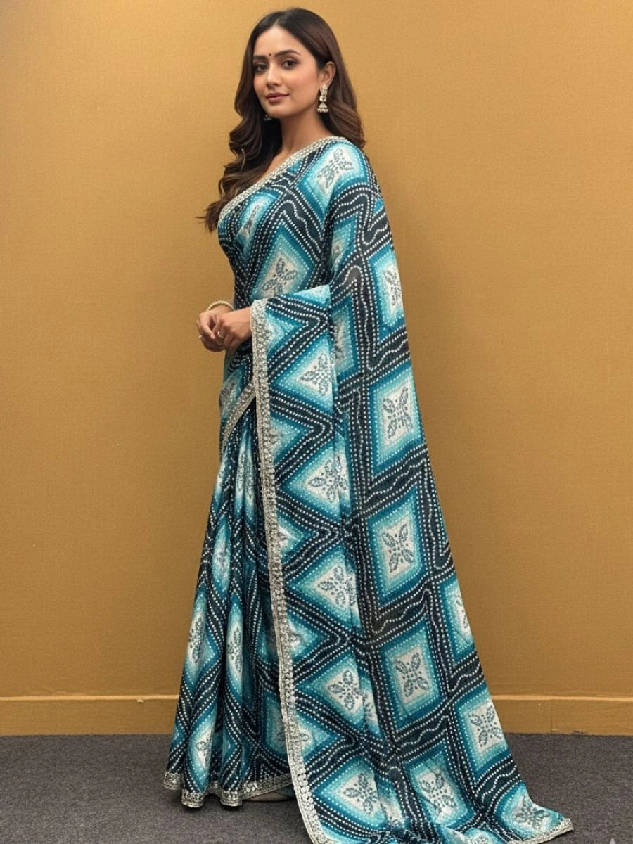 Woman wearing a blue and black patterned saree against a beige background