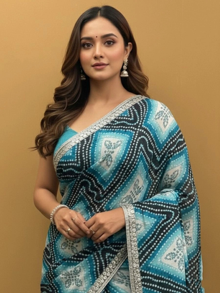 Woman wearing a blue and black patterned saree
