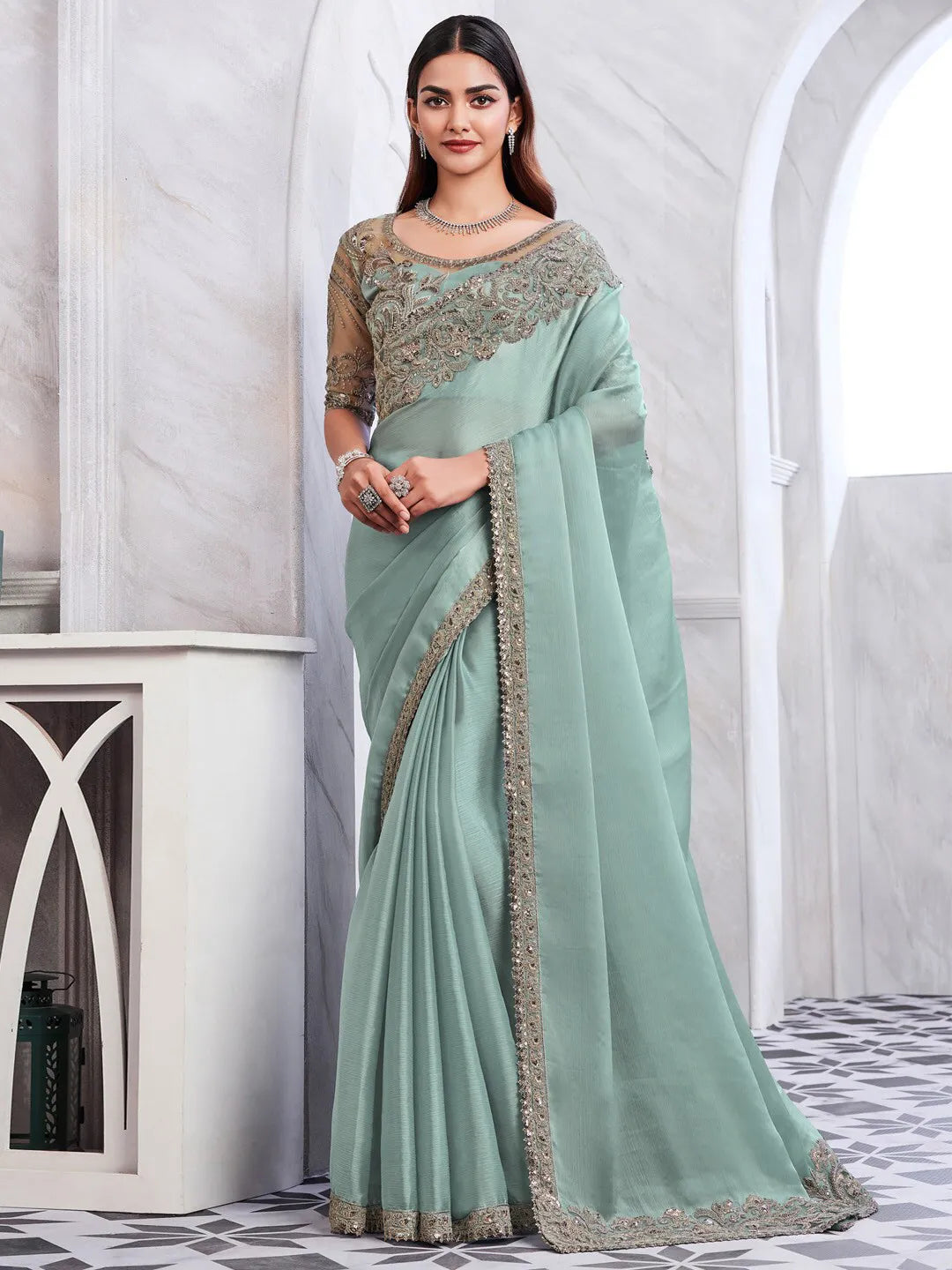 Designer sea green ethnic saree featuring intricate sequins and embroidery work
