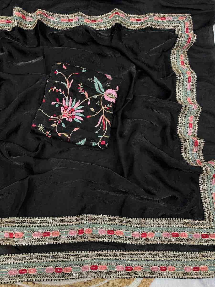 Black saree with colorful floral embroidery and decorative border