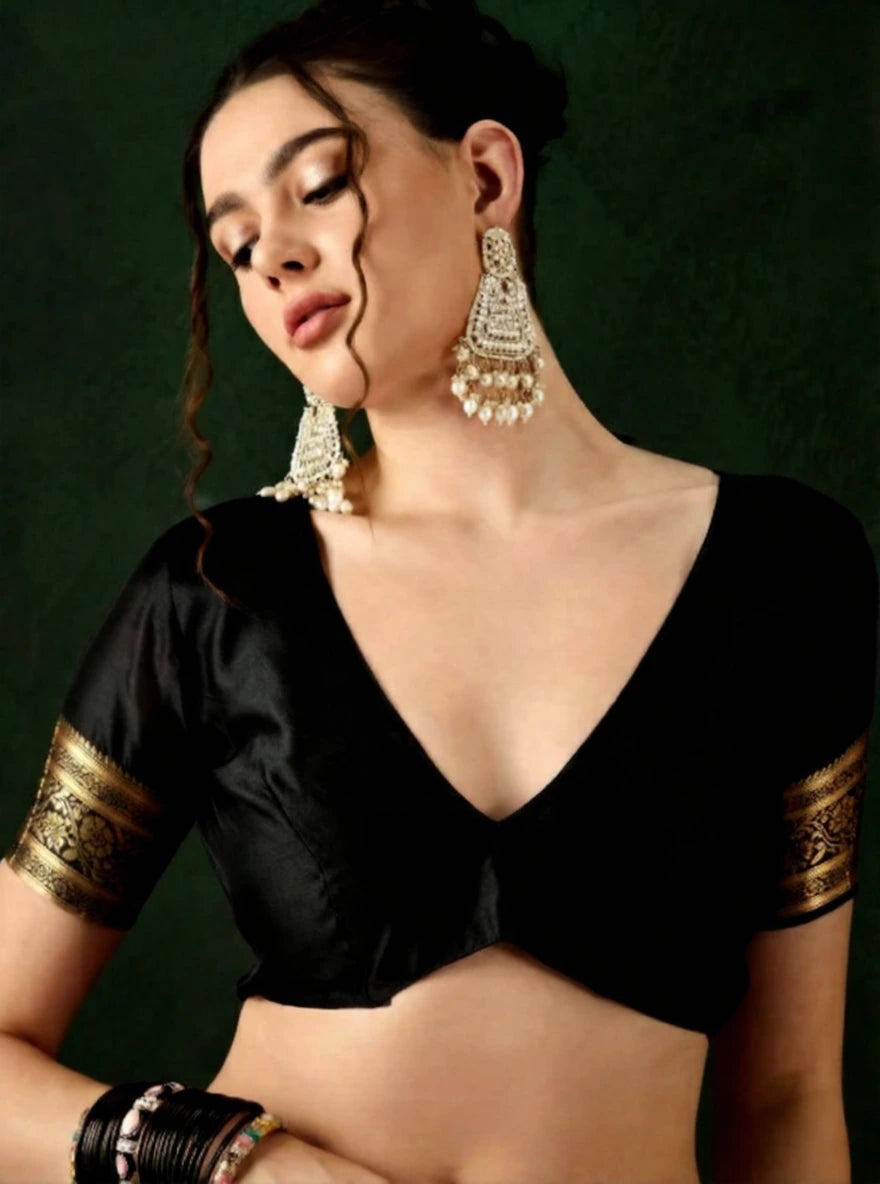 Fulari black and gold Banarasi saree with rich zari weaving and ornate border, styled for weddings and grand festive occasions