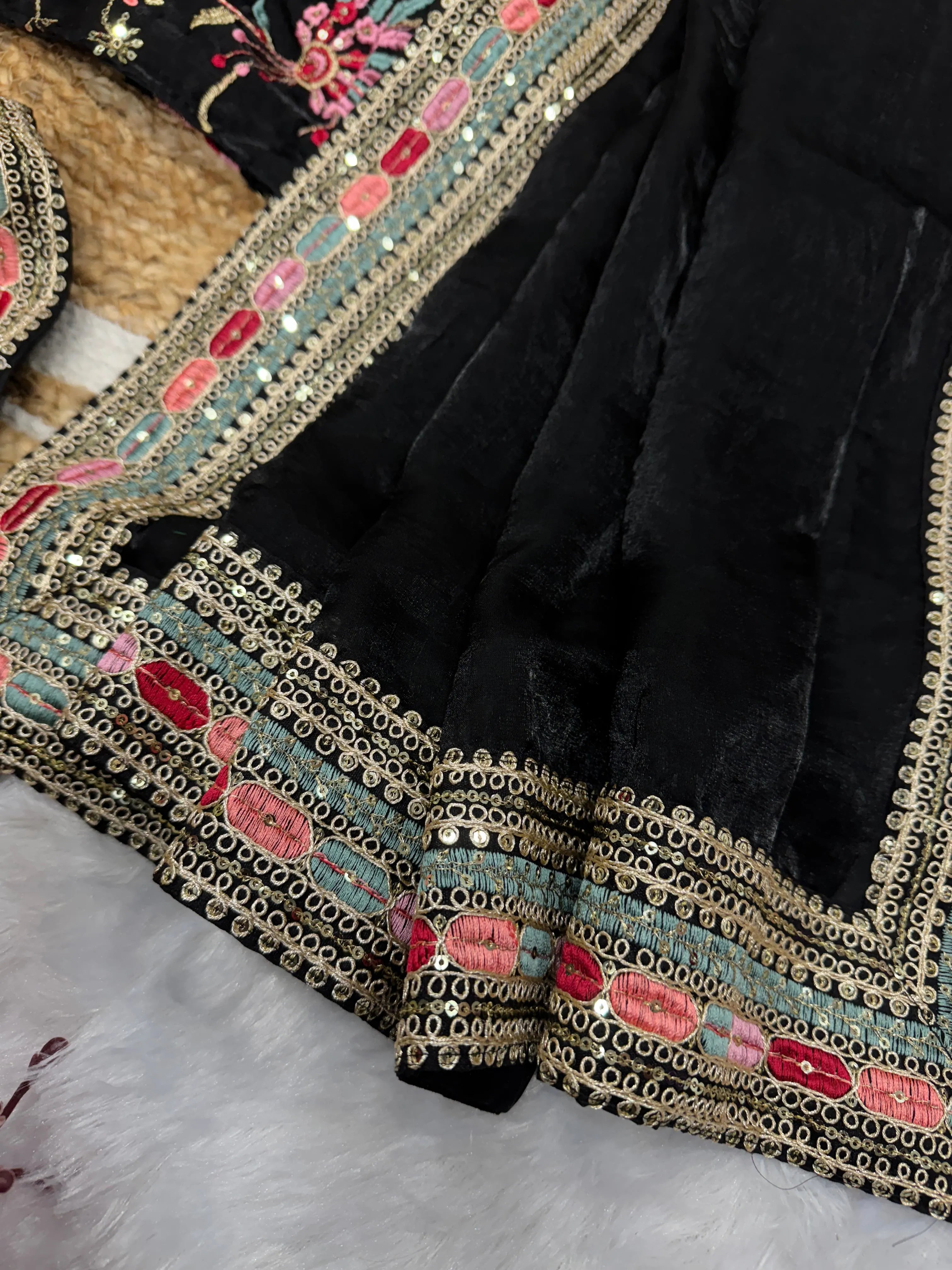 Fulari black occasion wear saree with refined embroidery and flowy drape, styled for modern festive looks