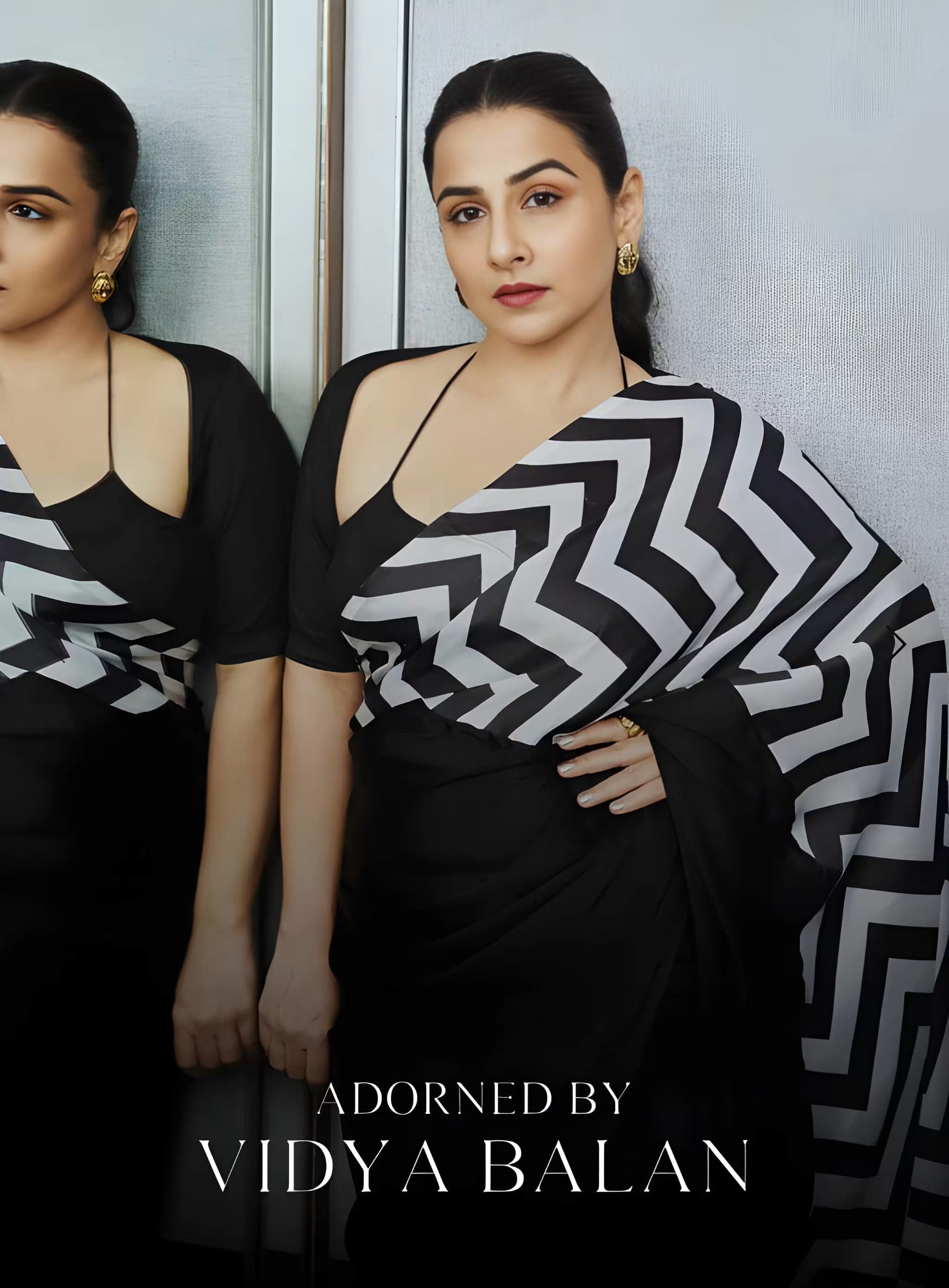 Fulari black satin saree with bold white chevron print pallu, styled for modern party and evening wear