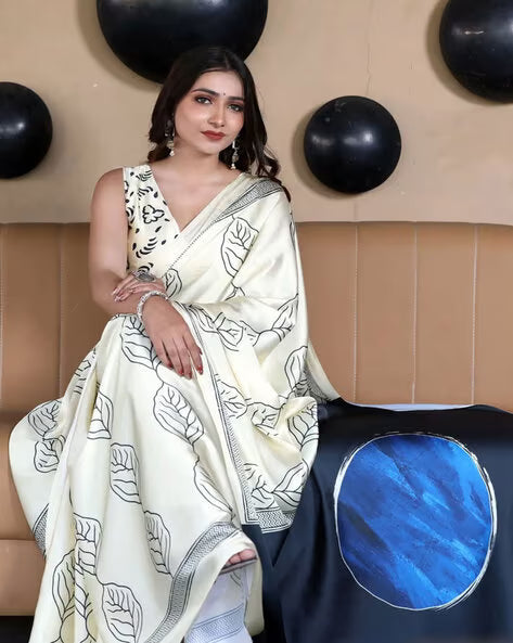 Elegant Fulari cream satin festive saree featuring a smooth drape and refined border detailing