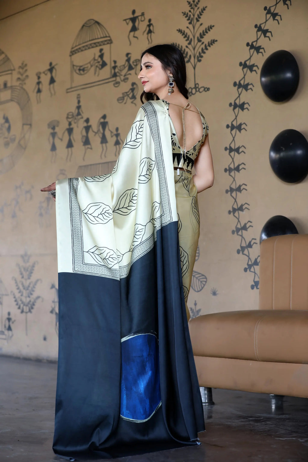 Fulari cream satin saree with elegant embroidered border, styled for party and festive occasions