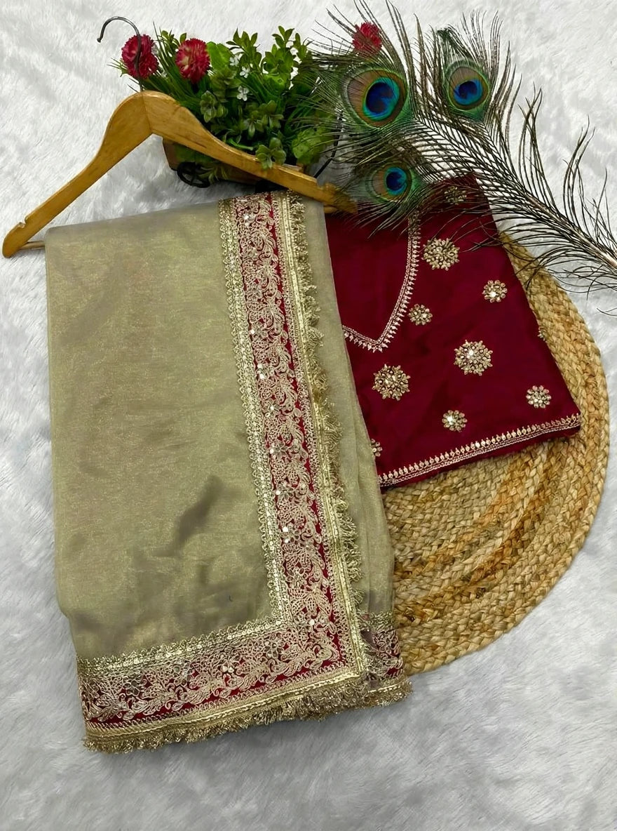 Fulari golden silk saree styled with a contrast red embroidered blouse.