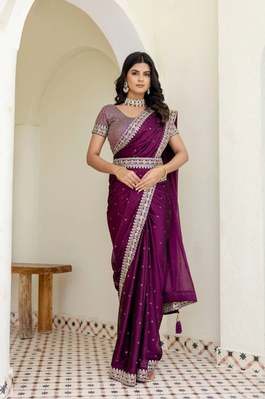 Fulari plum premium ethnic saree adorned with sparkling accents and a rich handcrafted border for special occasions