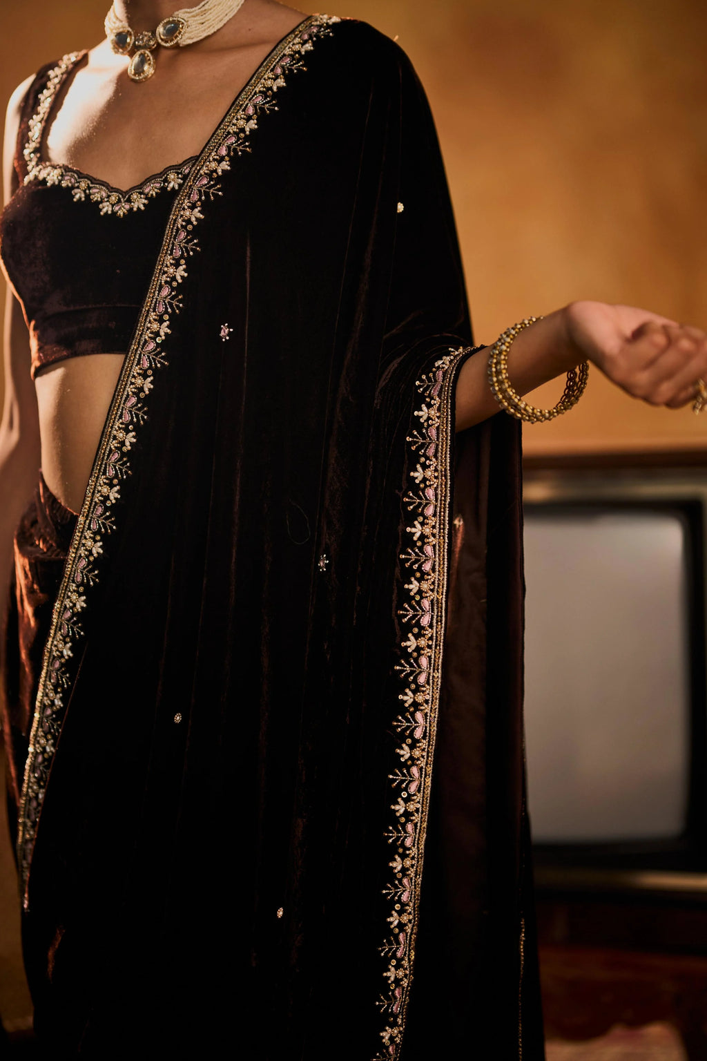 Premium velvet party wear saree in deep black with heavy work, crafted for weddings, receptions, and festive celebrations