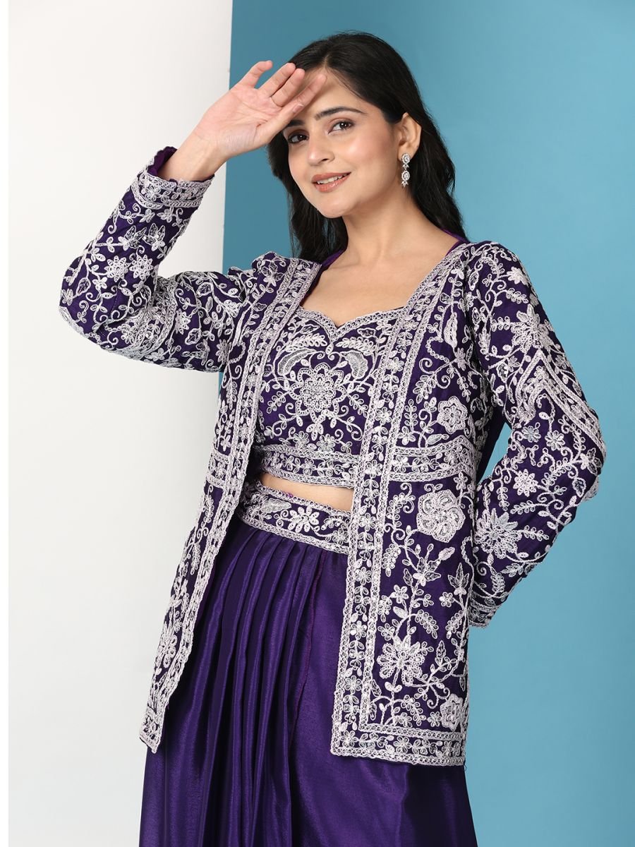 Woman wearing a purple and white patterned sharara