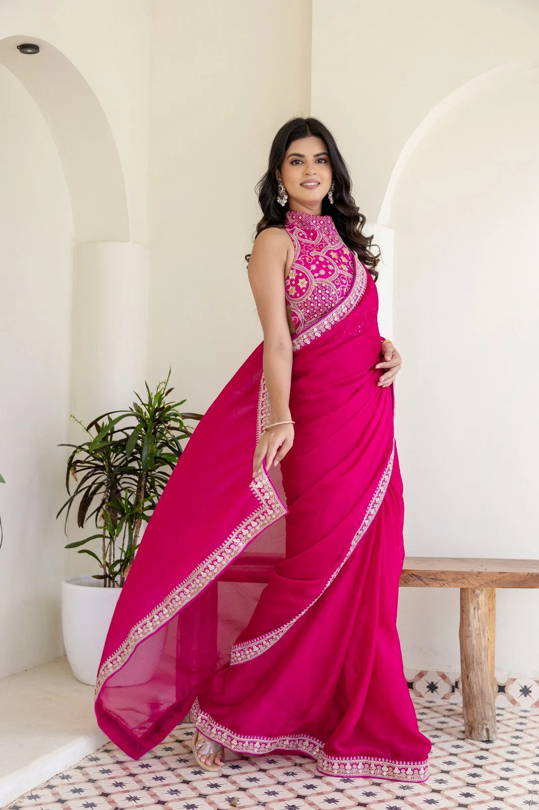Rani pink occasion-wear saree perfect for parties, engagements, and festive gatherings.