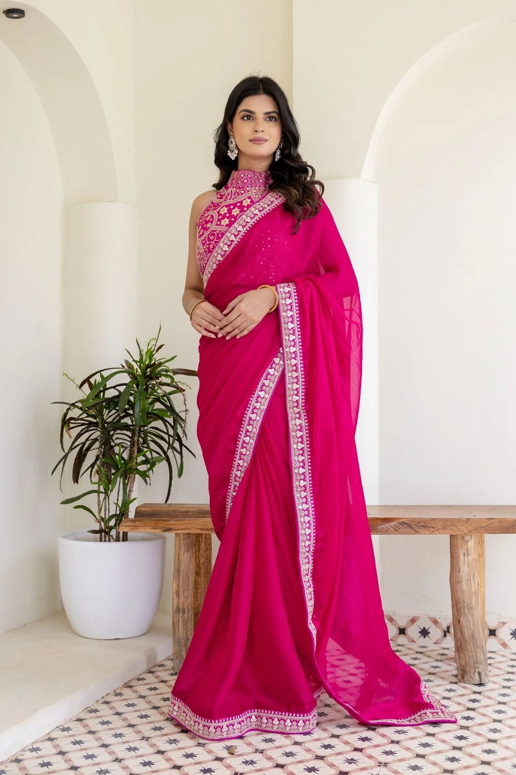 Rani pink saree by Fulari featuring rich festive detailing, perfect for weddings, parties, and traditional celebrations.
