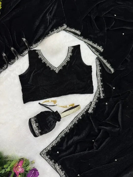 Black velvet designer saree by Fulari featuring intricate golden embroidery, ideal for weddings and luxury night events