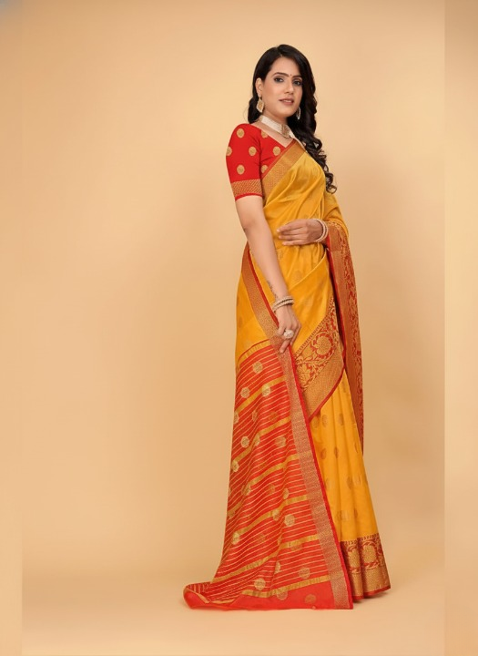 Woman wearing a yellow and red saree with a beige background