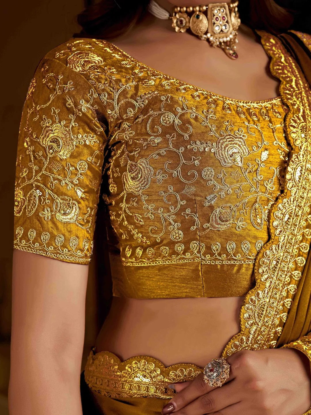 Gold saree by Fulari perfect for wedding guests with elegant embroidery and classic design