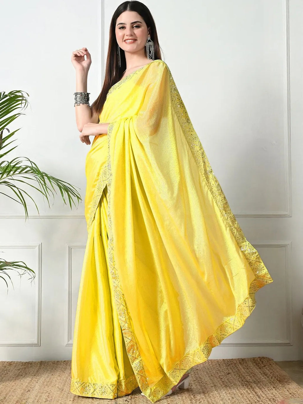 Bright yellow festive chiffon saree by Fulari with delicate sequin work
