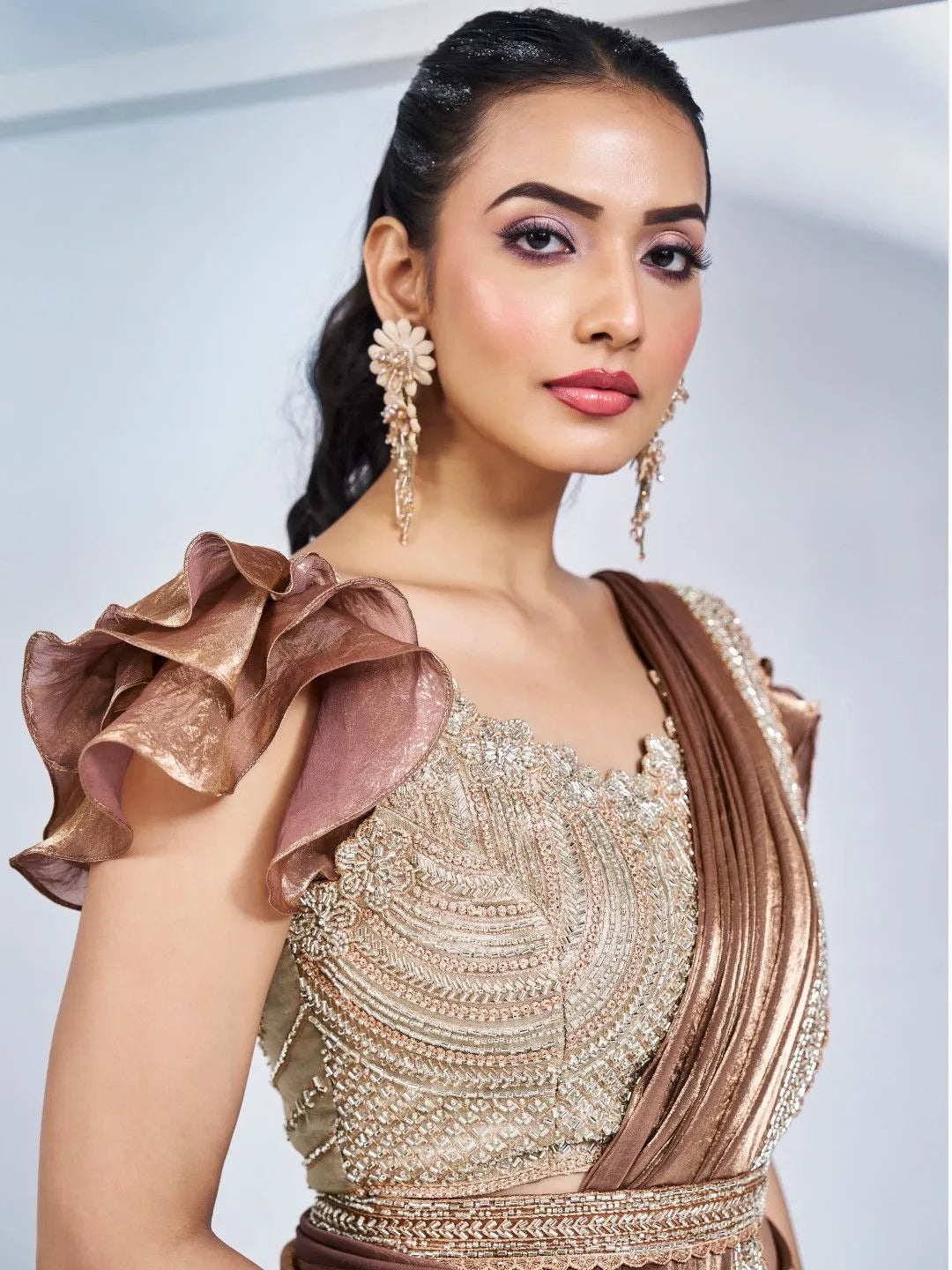 Brown designer festive saree by Fulari with detailed border work