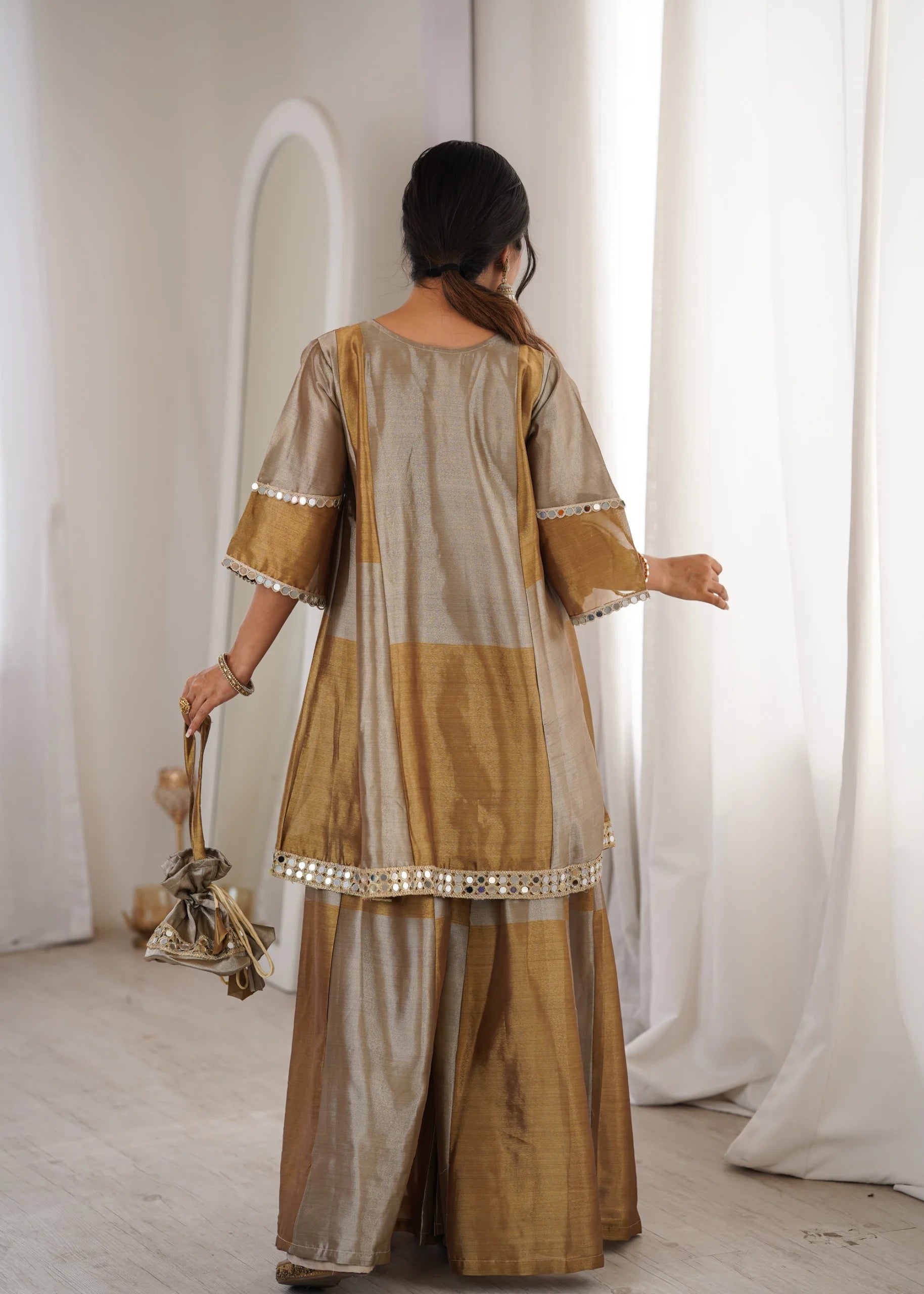 Designer mirror work kurta palazzo set by Fulari with flared top and coordinated bottom