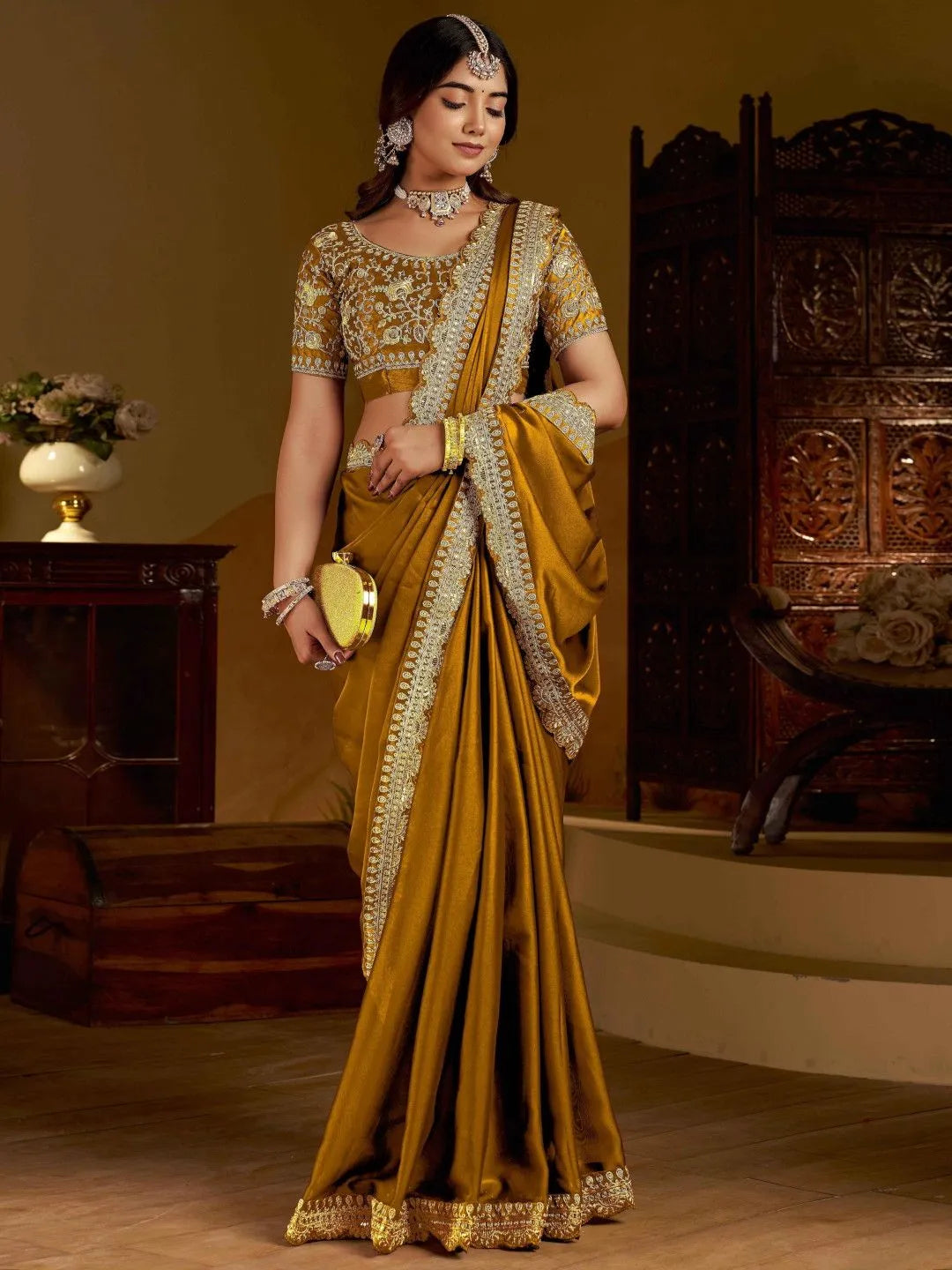 Ethnic gold saree by Fulari with rich texture and festive-ready styling