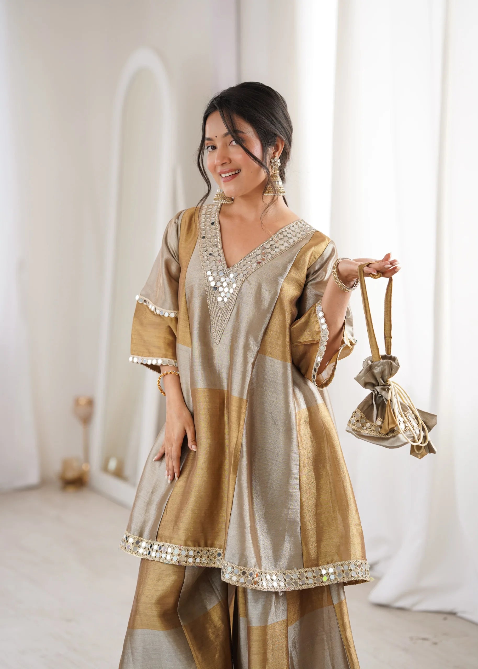 Festive gold palazzo outfit by Fulari featuring mirror embellishments and modern ethnic style