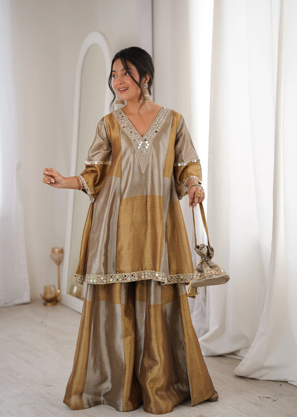 Luxury tissue palazzo suit by Fulari in gold tone with mirror work and statement sleeves