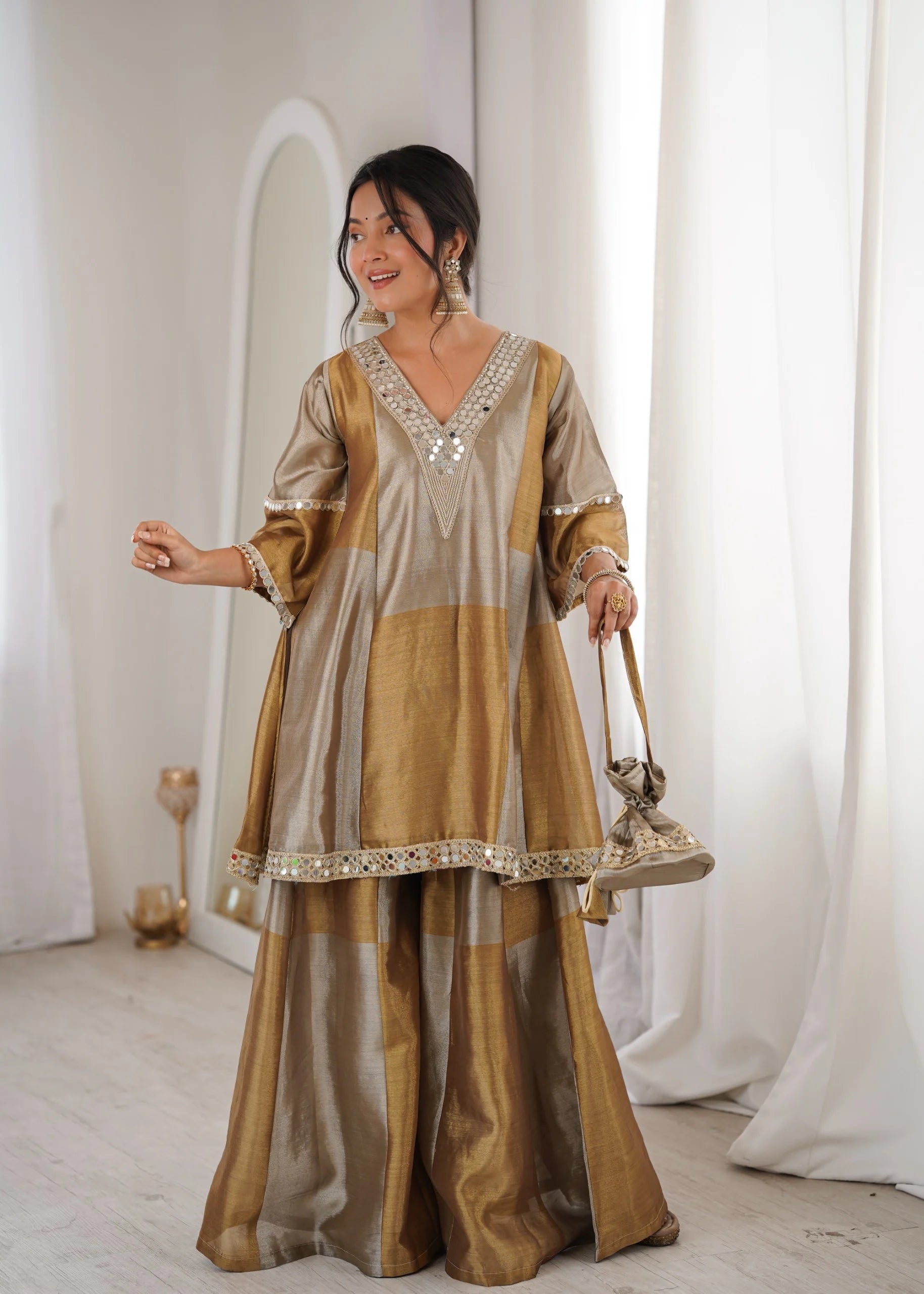 Luxury tissue palazzo suit by Fulari in gold tone with mirror work and statement sleeves