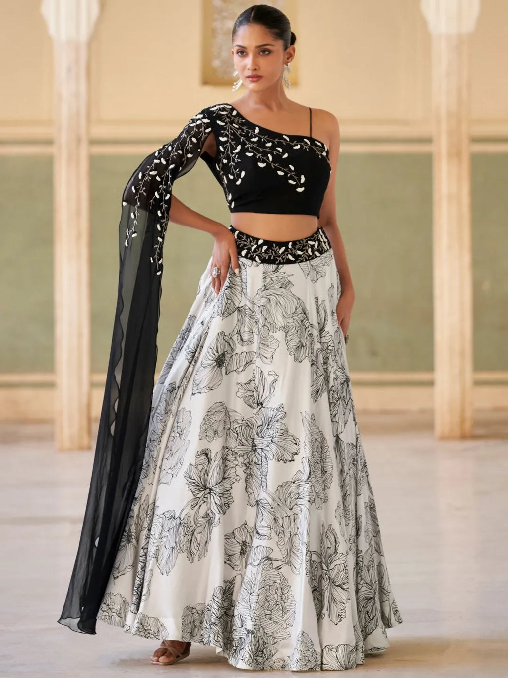 Modern black cocktail lehenga by Fulari with embellished blouse and flowy skirt