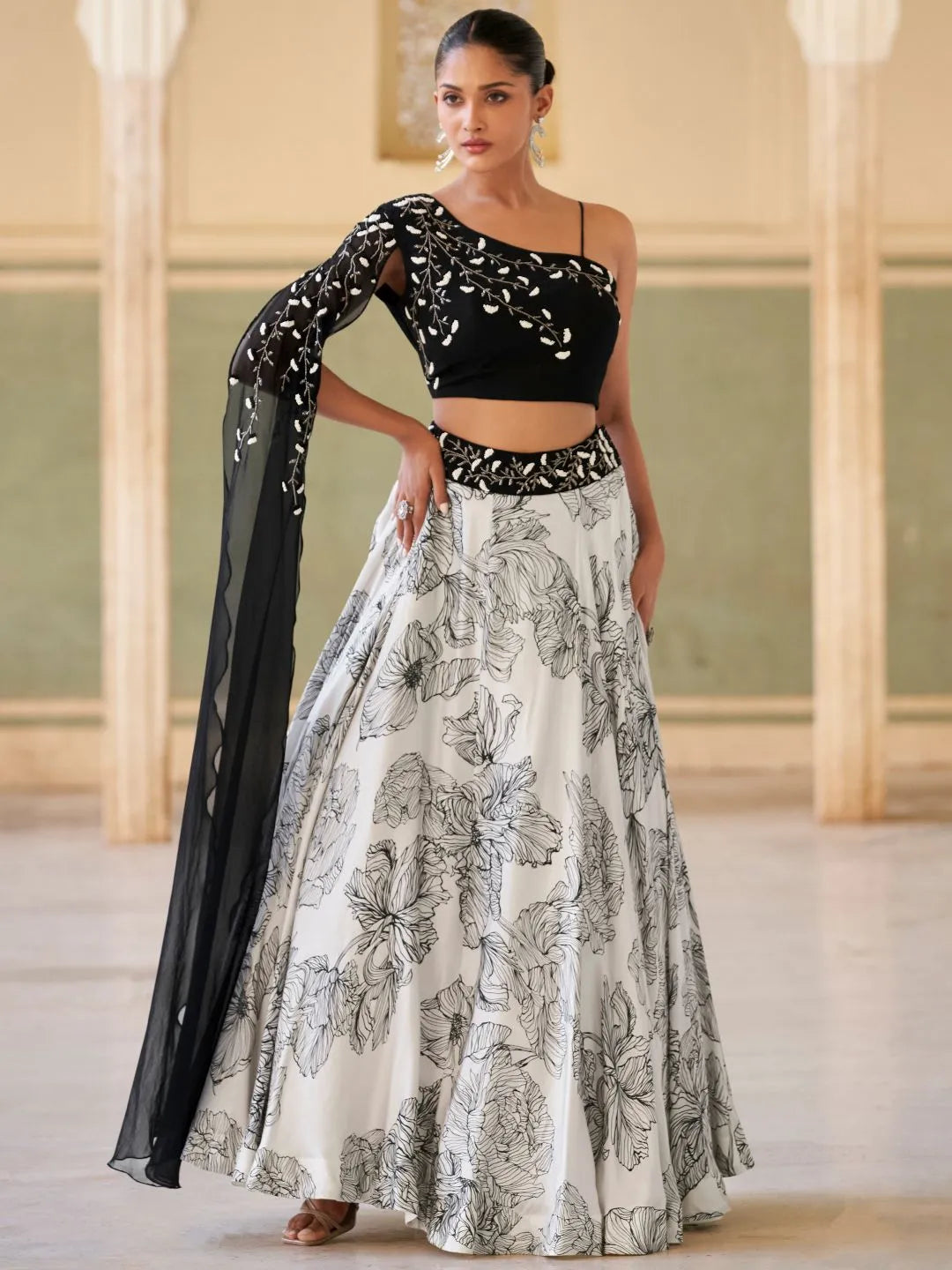 Modern black cocktail lehenga by Fulari with embellished blouse and flowy skirt