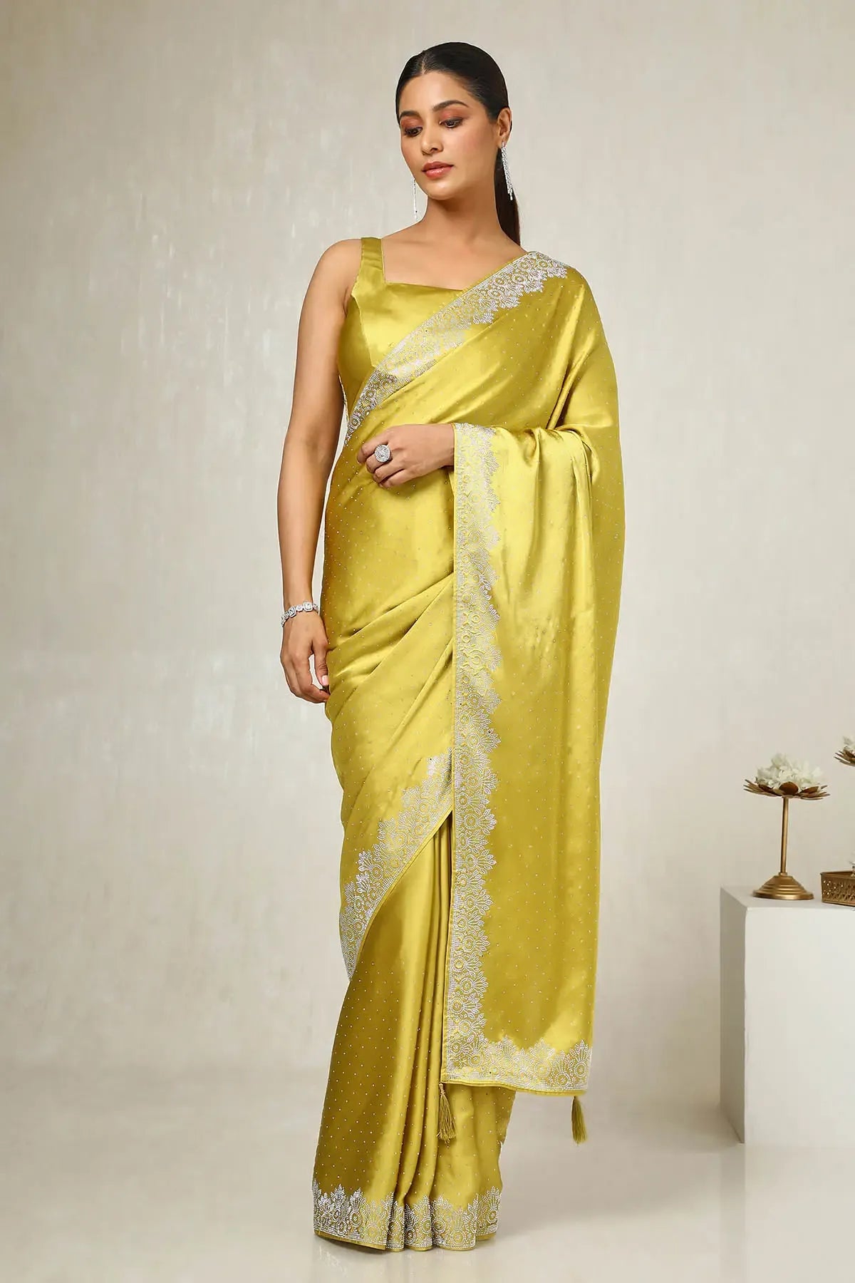 Designer mustard satin wedding guest saree with stone detailing by Fulari