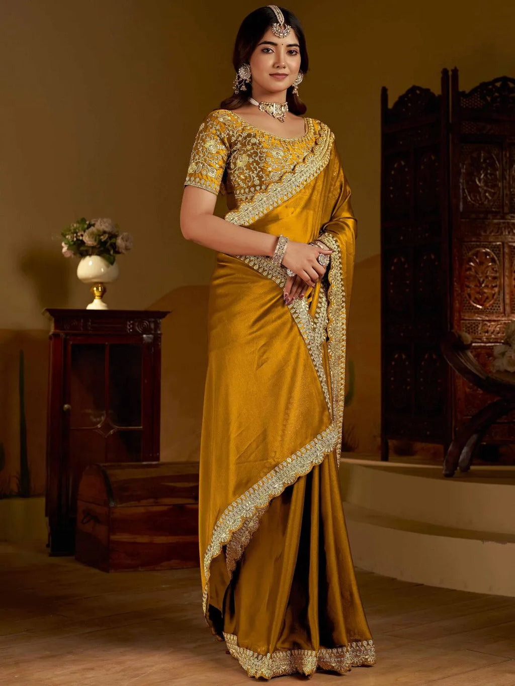 Mustard gold silk saree by Fulari with intricate zari border and rich festive appeal