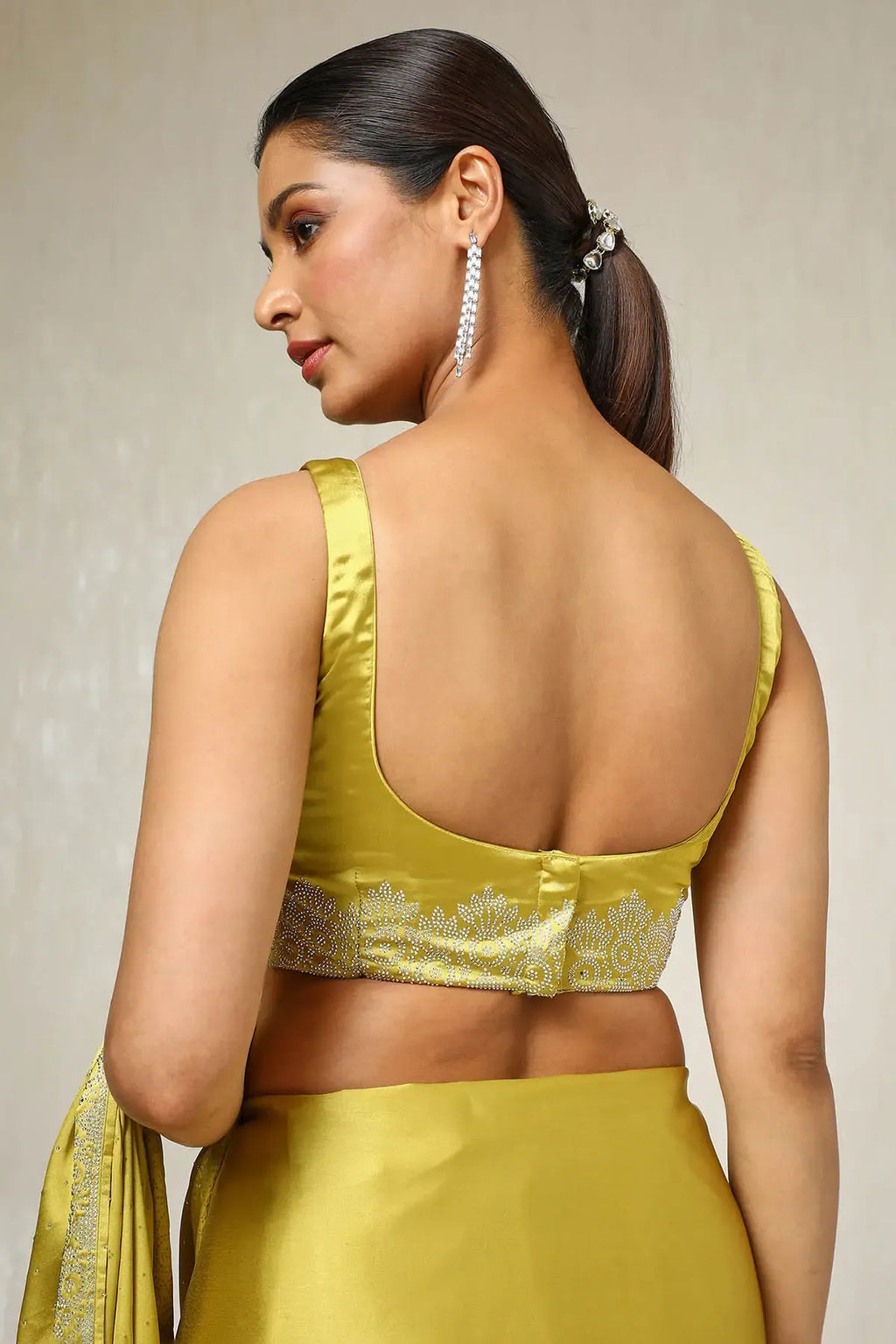 Mustard satin festive saree with elegant stone work border by Fulari
