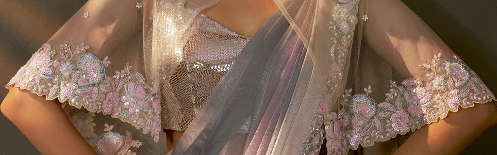 Pastel shaded designer saree with embroidered poncho blouse and belt by Fulari