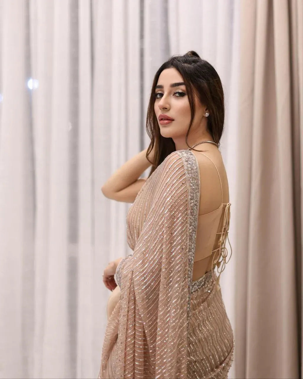 Peach glitter festive saree by Fulari for cocktail and wedding events