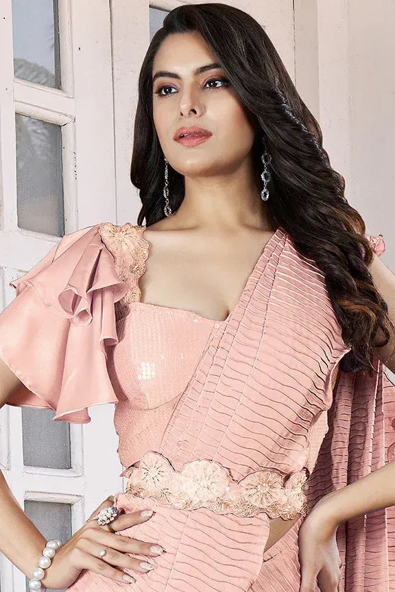 Peach wedding guest saree by Fulari with soft crepe satin silk fabric