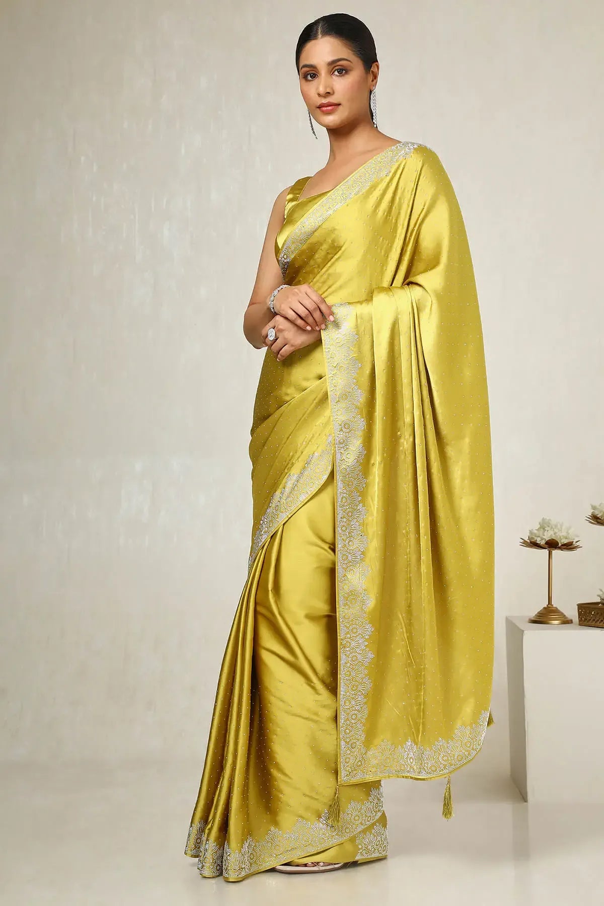 Premium mustard party wear satin saree by Fulari with delicate embellishments