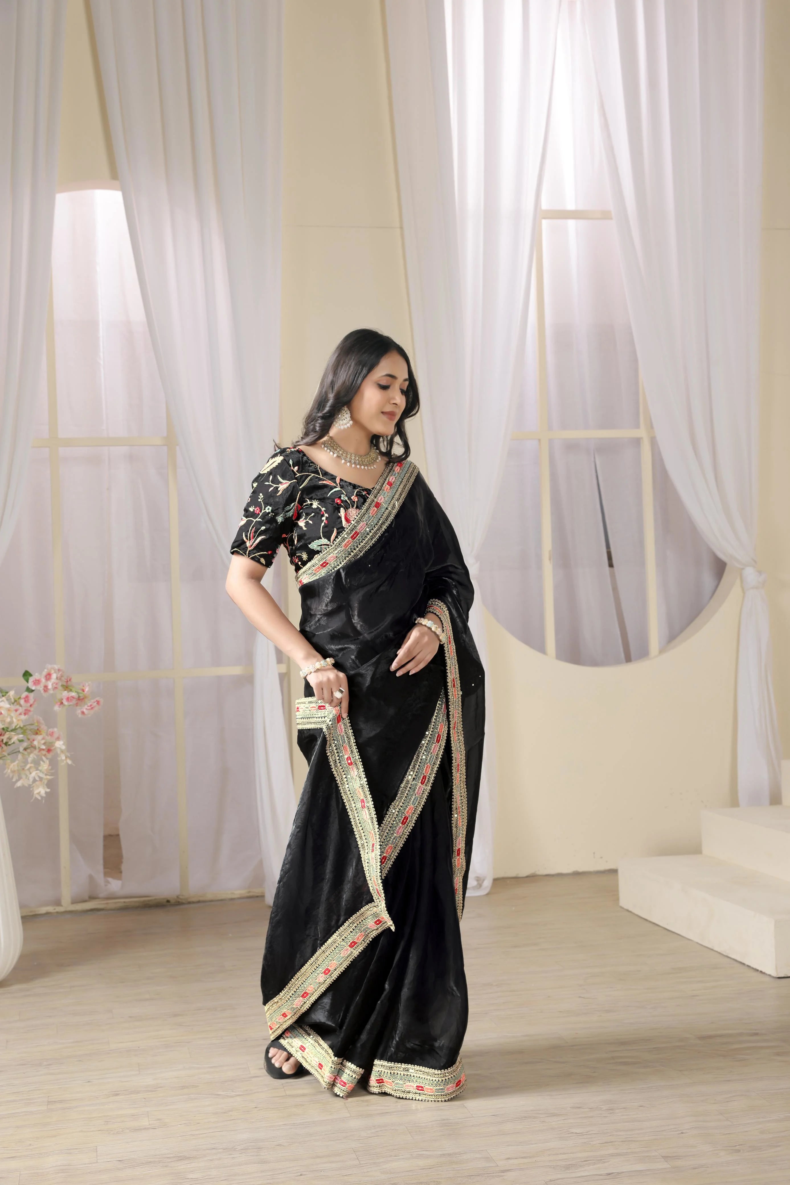 Luxury Fulari black evening wear saree with ornate border accents, perfect for festive and formal events