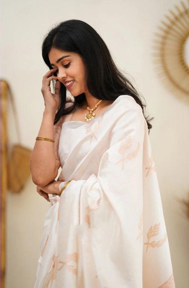 Elegant cream ethnic saree by Fulari featuring subtle motifs and a soft silk finish, ideal for traditional celebrations and events