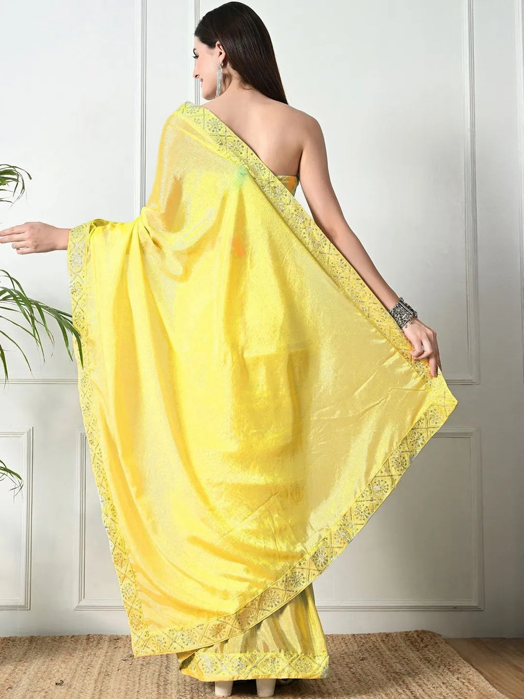 Yellow embellished chiffon party wear saree by Fulari with blouse piece