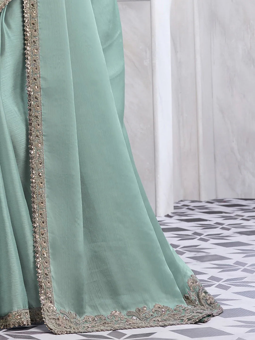 Elegant sea green chiffon saree with heavy embroidered blouse and border for party wear