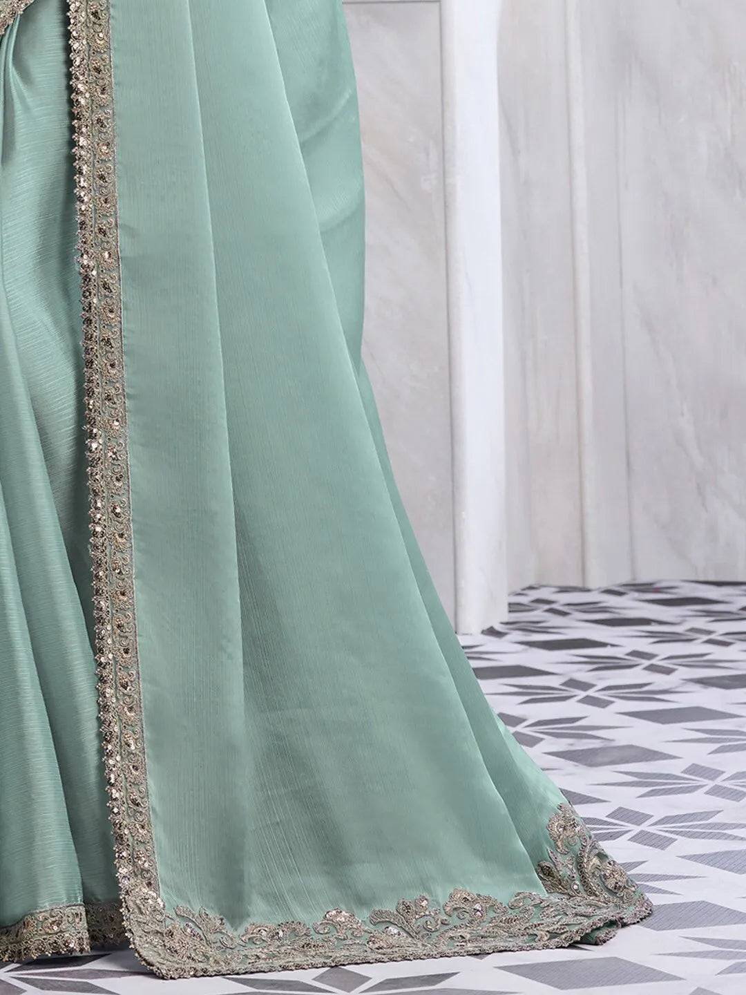 Elegant sea green chiffon saree with heavy embroidered blouse and border for party wear